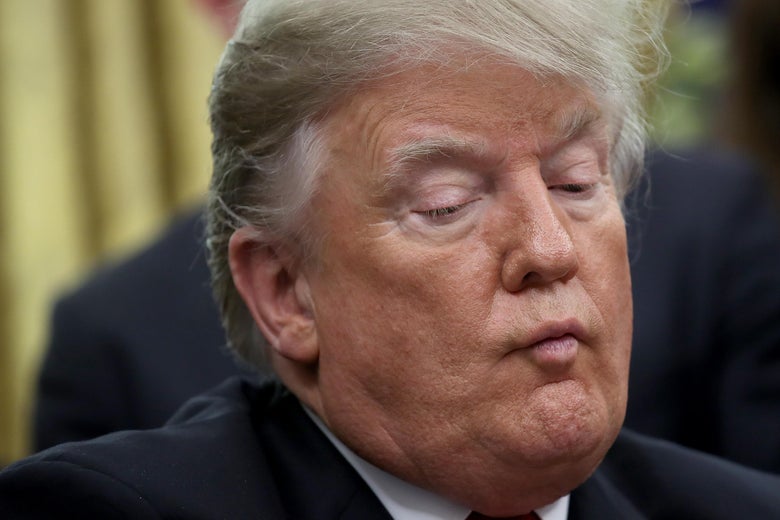 President Donald Trump participates in the signing ceremony for the First Step Act and the Juvenile Justice Reform Act in the Oval Office of the White House on December 21, 2018 in Washington, D.C.